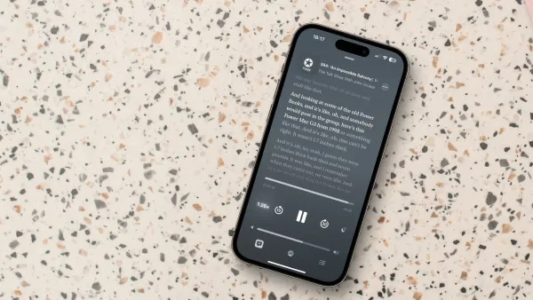 iPhone 14 pro on table showing podcast transcript feature