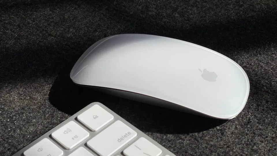 Magic Mouse with keyboard on black felt cloth